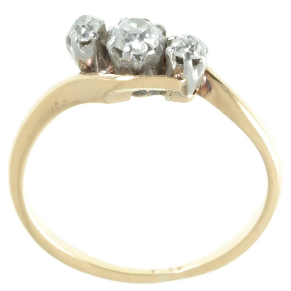 Three stone diamond crossover ring