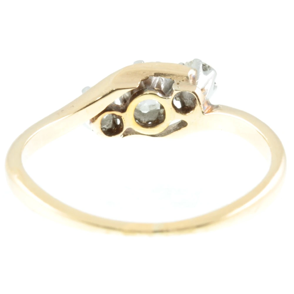 Three stone diamond crossover ring